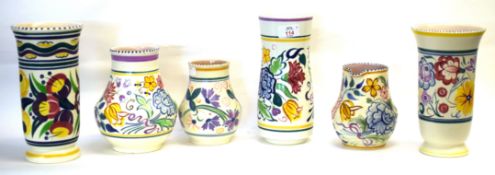 Group of Poole pottery vases with floral designs after Truda Carter, largest 23cm high (6)