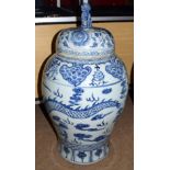 Large pair of Chinese porcelain temple jars and covers with dog of foo finials, the jars decorated