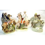 Group of 3 Staffordshire figures of characters on horseback, including 'St George and the Dragon'