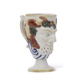 Early 19th century Staffordshire Rodney or Bacchus cup decorated in polychrome, the interior with