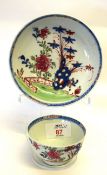 Lowestoft porcelain tea bowl and saucer with a Redgrave design of flowers with rock work against a
