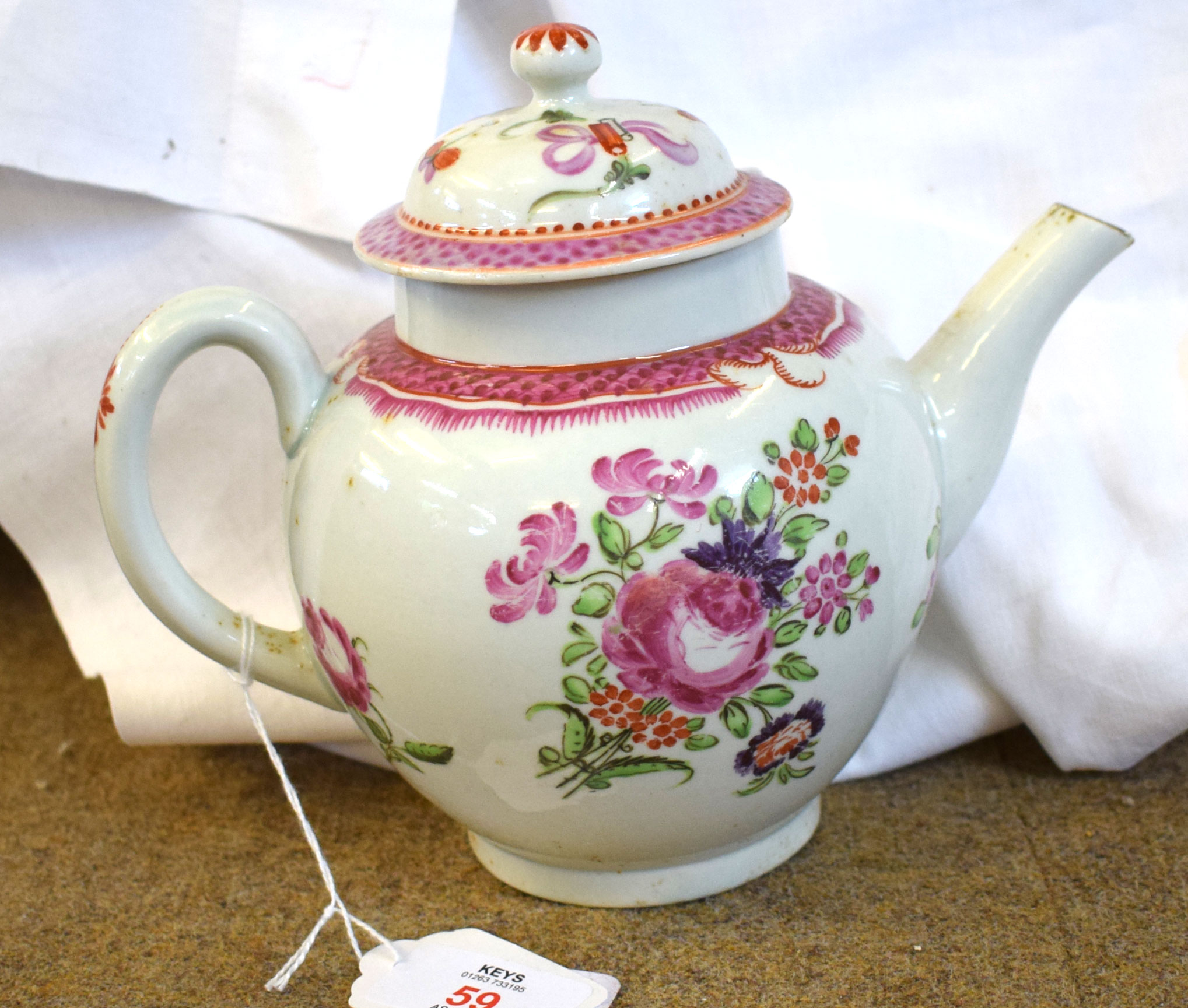18th century Lowestoft porcelain tea pot decorated in Compagnie des Indes style with floral sprays
