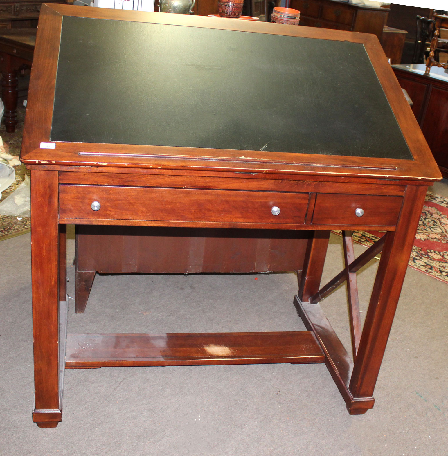 Reproduction mahogany architects table, the adjustable top with central inset and the frieze below