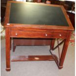 Reproduction mahogany architects table, the adjustable top with central inset and the frieze below