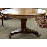 William IV period mahogany circular pedestal breakfast table on triform base with heavy paw feet,