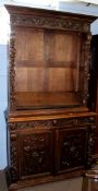 Victorian oak Gothic carved bookcase cabinet, upper section with adjustable shelving, the lower