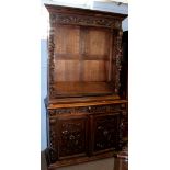 Victorian oak Gothic carved bookcase cabinet, upper section with adjustable shelving, the lower