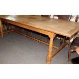 Early 20th century light oak and pine rectangular dining table, the panelled top on a light oak