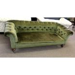 Late 19th century oak framed green button back upholstered Chesterfield, short tapering spade