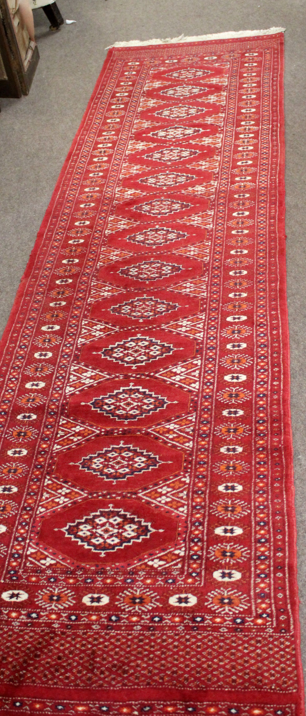 Long Bokhara type wool runner in red, black and beige, 78cm x 304cm