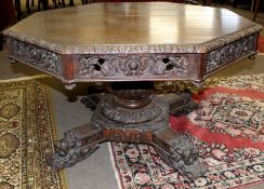 Victorian Gothic oak octagonal pedestal dining table heavily carved throughout with foliage etc,