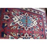 Mid/late 20th century Caucasian wool rug with geometric patterns in pale red, blue and beige,