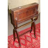 Late 19th century oak campaign desk, folding top with worn and fitted interior raised on a folding