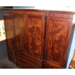 Large Regency period mahogany break front wardrobe moulded corners over central panelled doors