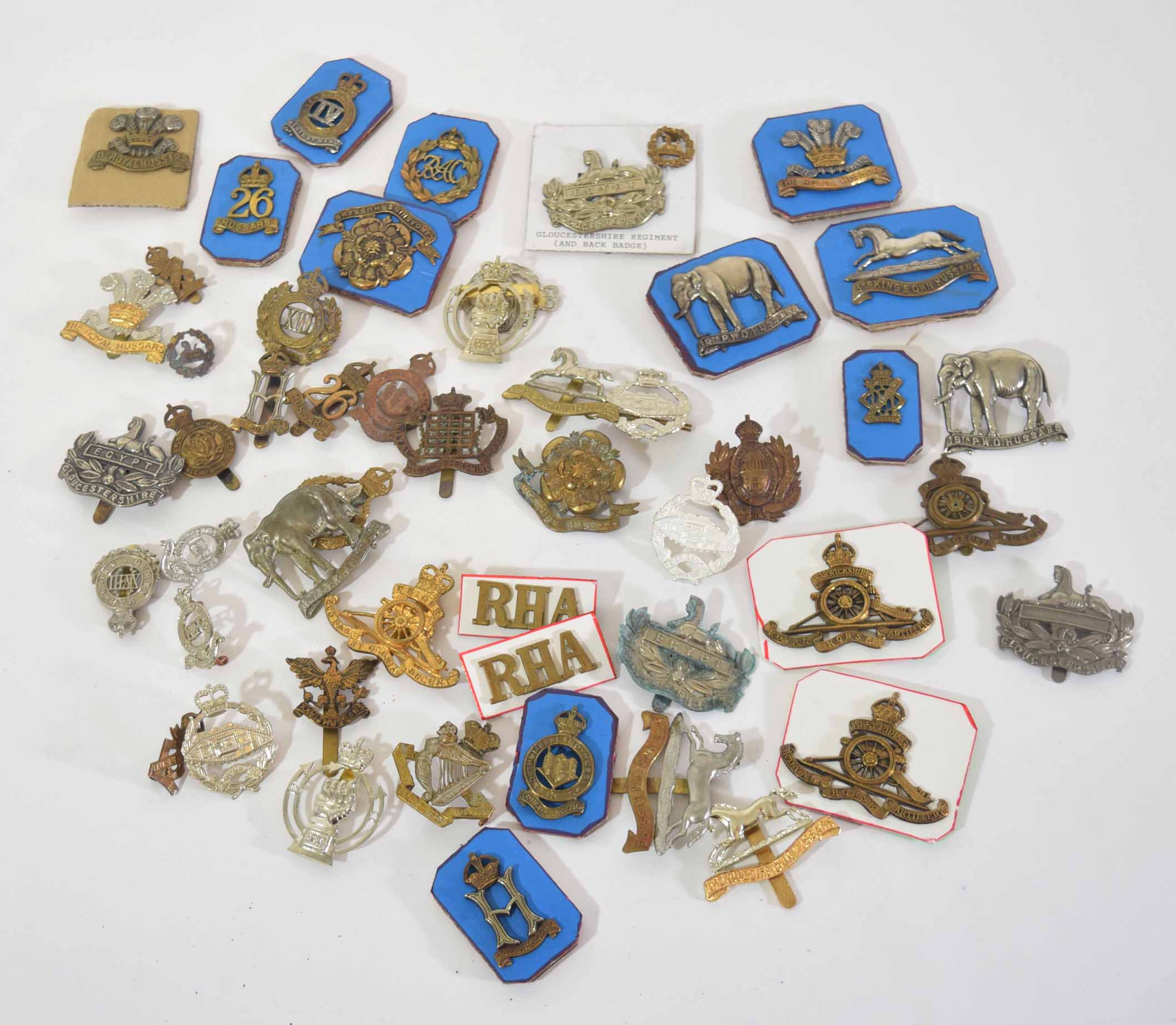 Mixed quantity of military cap badges, varying dates and crowns to include Royal Armoured Corps,