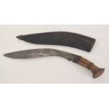 20th century Nepalese Kukri with wooden handled grip and steel plated pommel, in worn leather