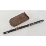 Late 19th/early 20th century military flute/piccolo in leather case, no markings except War Dept