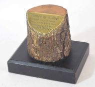 Paperweight comprising a tree trunk mounted on metal plaque inscribed "tree planted by Adolf