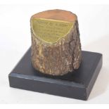 Paperweight comprising a tree trunk mounted on metal plaque inscribed "tree planted by Adolf