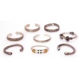 Mixed Lot: five white metal torque bangles, stamped 925, together with three hinged examples, 115gms