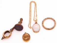 Mixed Lot: a 10K stamped bracelet suspending a framed opalescent pendant, a gilt metal watch