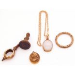 Mixed Lot: a 10K stamped bracelet suspending a framed opalescent pendant, a gilt metal watch