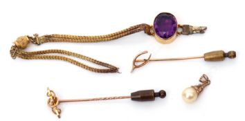 Mixed Lot: two 15ct stamped stick pins, a yellow metal and amethyst bracelet (broken) together