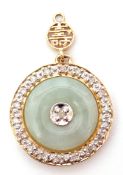 Modern jade and diamond set pendant, the circular shaped jade panel centering a small diamond in a