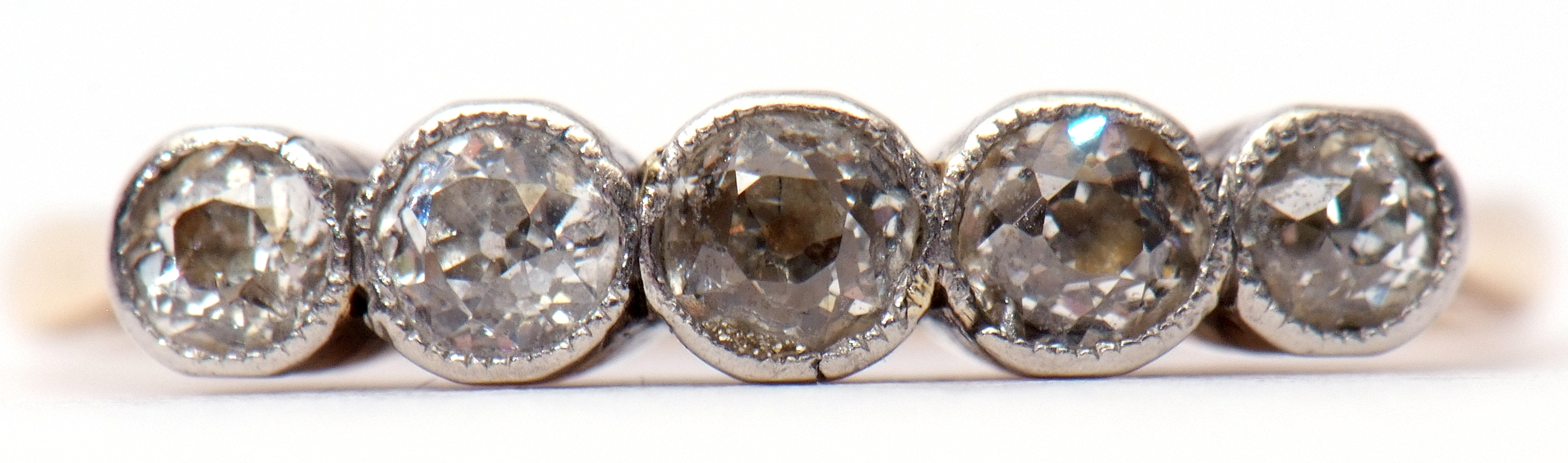 Five-stone diamond ring, each individually bezel set, stamped 18c, size O