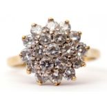 Diamond cluster ring, a design of two tiers of small round brilliant cut diamonds (19) stamped 18ct,