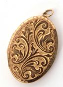 9ct gold double photo locket of oval hinged shape, the front foliate engraved, the verso of plain