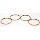 Four 9ct gold matching bangles each engraved with a bright cut decoration, 20.2gms gross weight