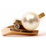 Modern stylised design pearl and small diamond dress ring the angular cross-over shoulders