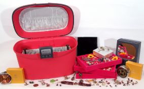 Pink Samsonite make-up/jewellery case and contents to include various costume jewellery, rings,