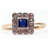 Art Deco sapphire and diamond cluster ring, the square cut cushion shape sapphire raised within a