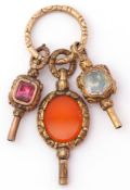 Mixed Lot: three Victorian gilt metal pendant watch keys, circa 1890, one set with oval carnelian