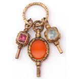 Mixed Lot: three Victorian gilt metal pendant watch keys, circa 1890, one set with oval carnelian