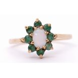 Modern 9ct gold opalescent and emerald cluster ring, the oval cabochon centre opalescent within a