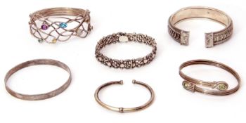 Mixed Lot: five various white metal bangles/bracelets, together with a metal torque bracelet