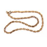 Low grade yellow metal chain, a design with X-shaped links joined by textured oval links, 19cm