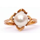 Yellow metal and cultured pearl dress ring, the pearl raised and set between four petals to a