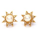 Pair of cultured pearl and diamond earrings, the central pearl raised within a diamond set raise,