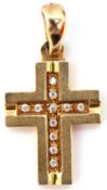 Mid-grade yellow metal cross, the engraved channel set with small pastes to a polished bale, 3 x 1.