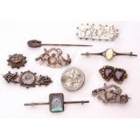 Mixed Lot: four hallmarked antique silver brooches, together with a metal butterfly wing brooch,