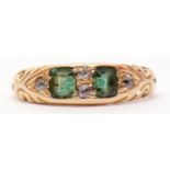 Antique 18ct gold emerald and diamond ring featuring 2 cushion cut emeralds interspersed with 5