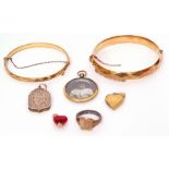 Mixed Lot: two rolled gold hinged bracelets, two heart pendants, a double sided photo locket, a gilt