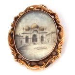 Antique double sided glazed oval pendant brooch, one side depicting an Indian temple, the verso a