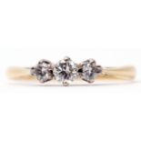 Three-stone diamond ring featuring 3 graduated brilliant cut diamonds, raised in upswept