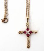 9ct gold cross, the centre applied with small diamonds and rubies suspended from a metal chain, 1.