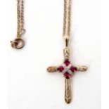 9ct gold cross, the centre applied with small diamonds and rubies suspended from a metal chain, 1.